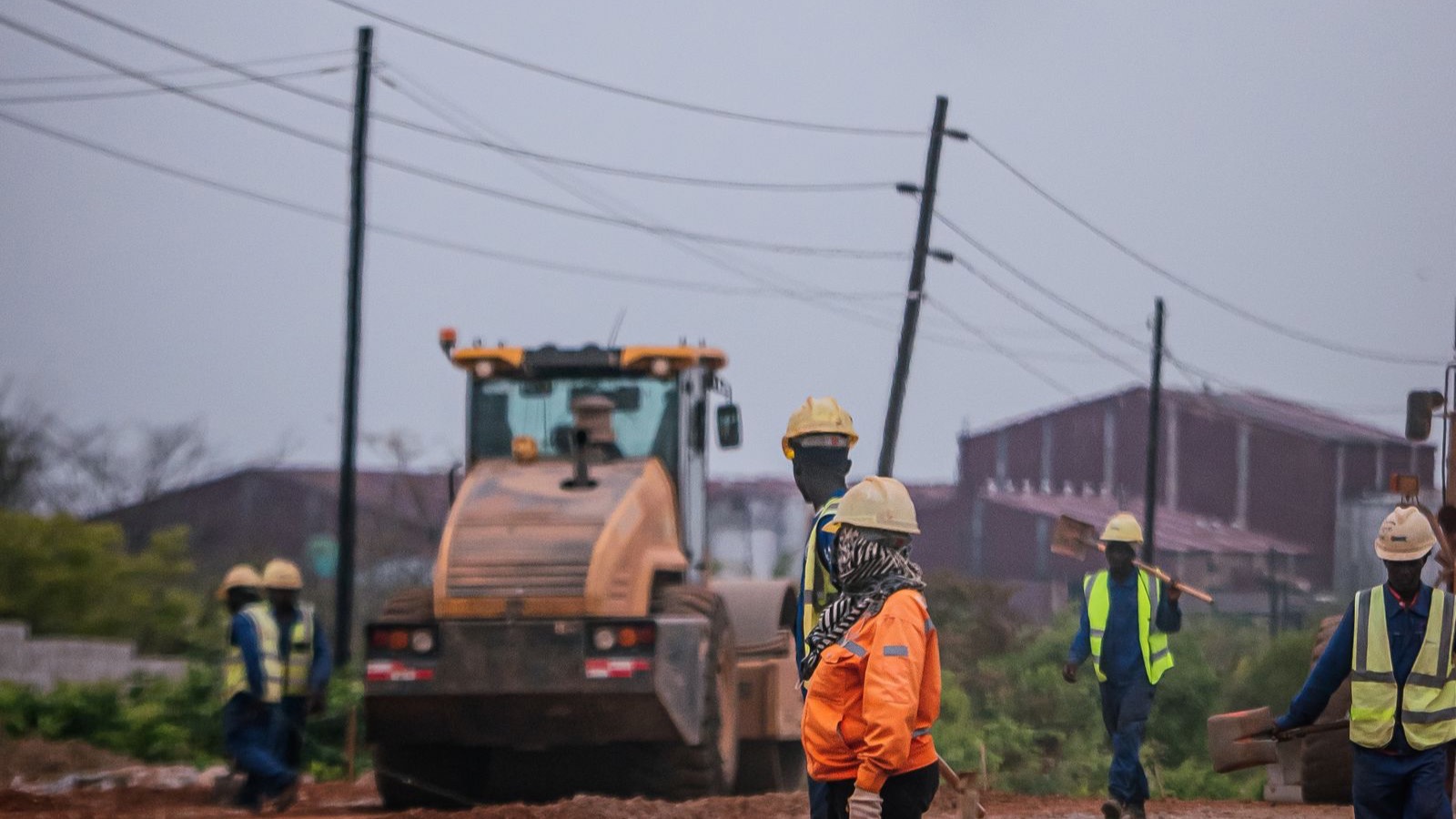 Road construction crew and heavy equipment representing construction intelligence in Georgia
